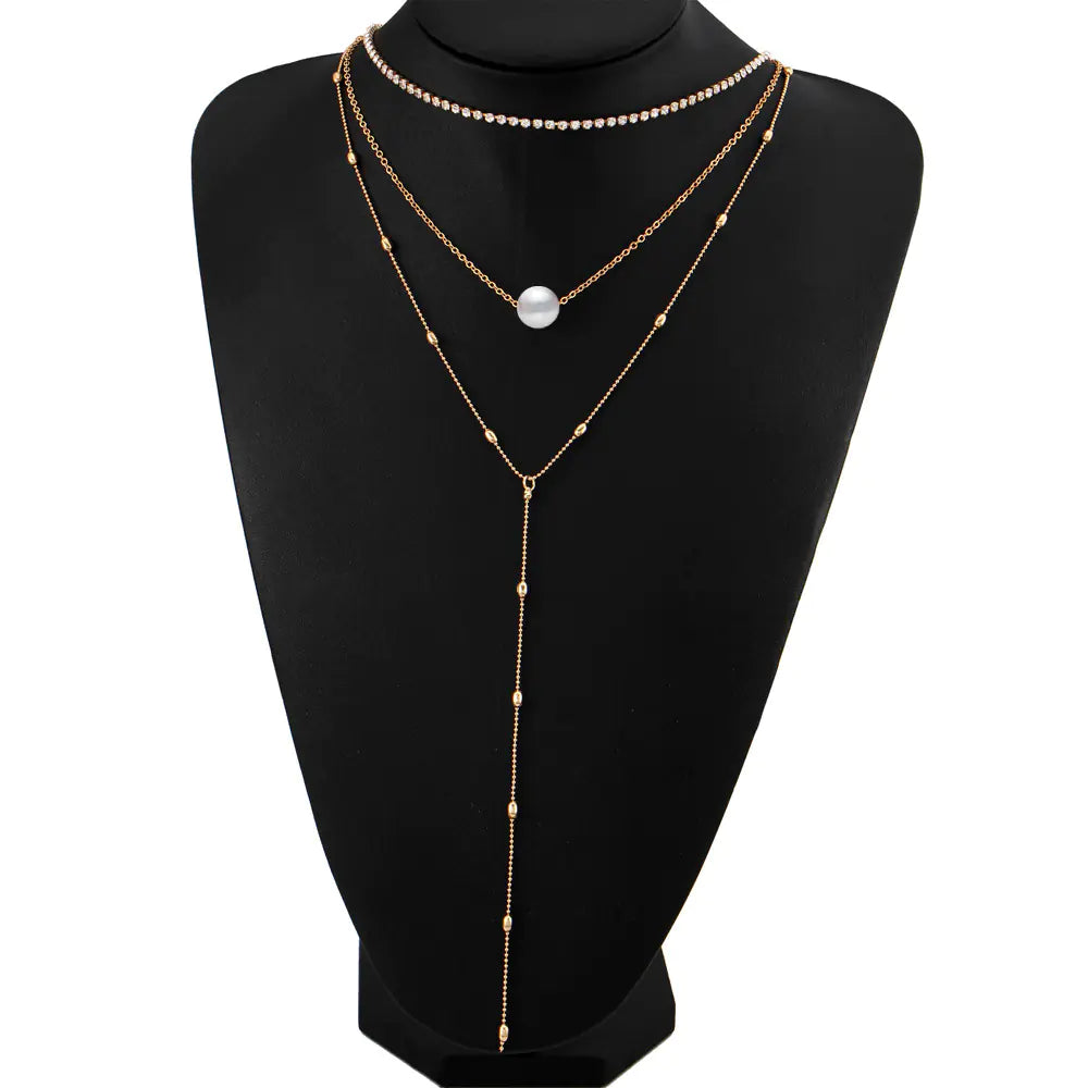 Silver Three-Layer Pearl Layered Necklace with Crystal Pendant and Geometric Chain Style