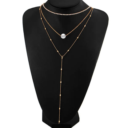 Silver Three-Layer Pearl Layered Necklace with Crystal Pendant and Geometric Chain Style