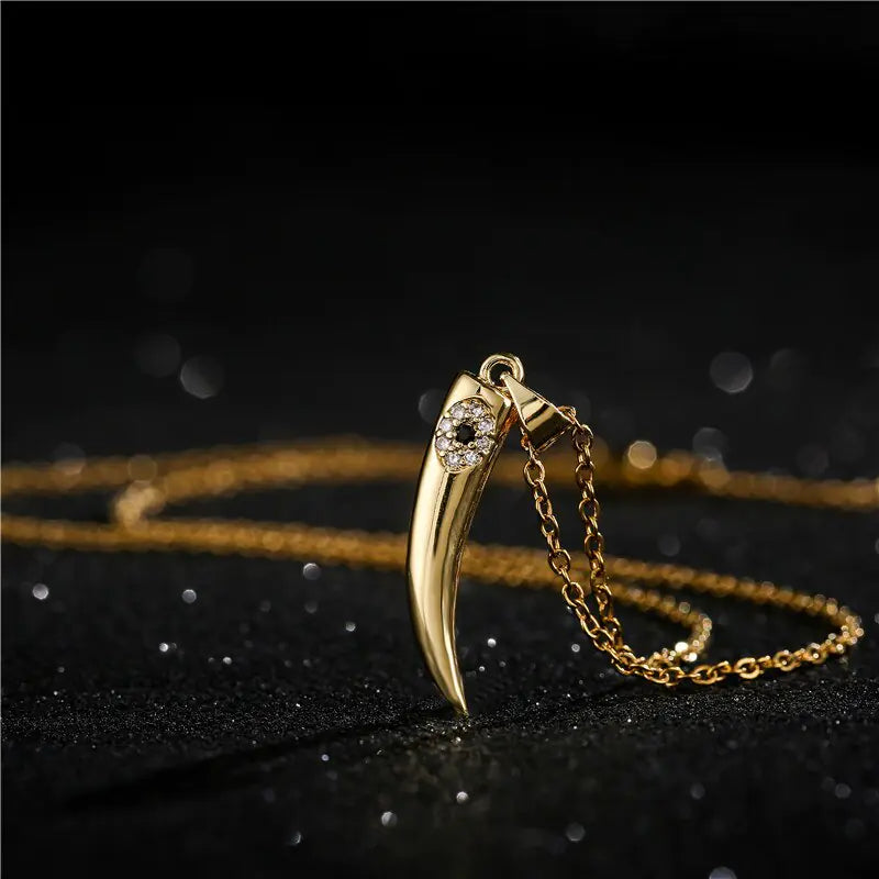 Gold Wolf Tooth Pendant Necklace with Devil's Eye Design