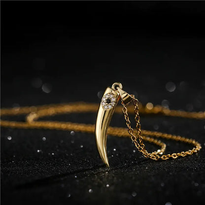 Gold Wolf Tooth Pendant Necklace with Devil's Eye Design