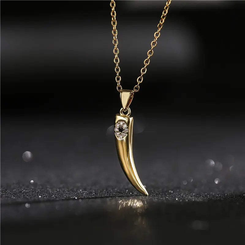 Gold Wolf Tooth Pendant Necklace with Devil's Eye Design