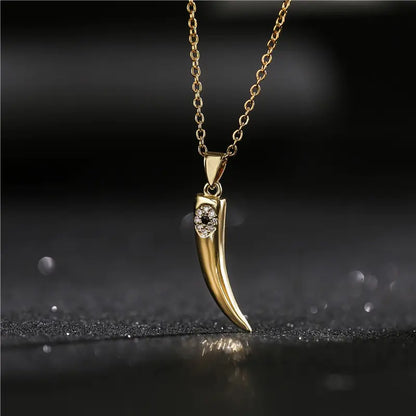 Gold Wolf Tooth Pendant Necklace with Devil's Eye Design