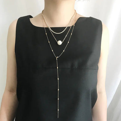 Silver Three-Layer Pearl Layered Necklace with Crystal Pendant and Geometric Chain Style