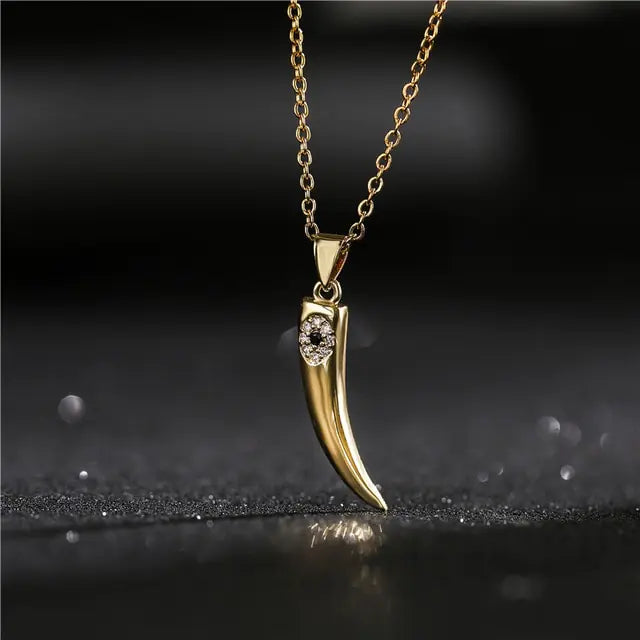 Gold Wolf Tooth Pendant Necklace with Devil's Eye Design