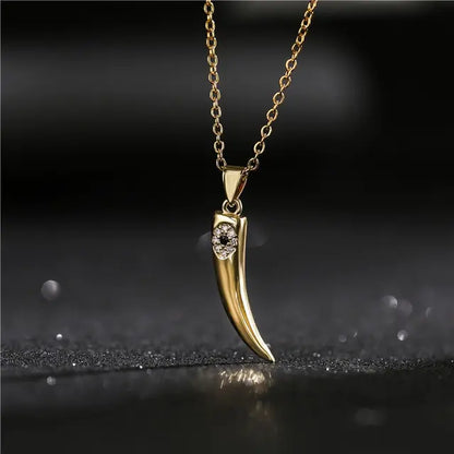 Gold Wolf Tooth Pendant Necklace with Devil's Eye Design